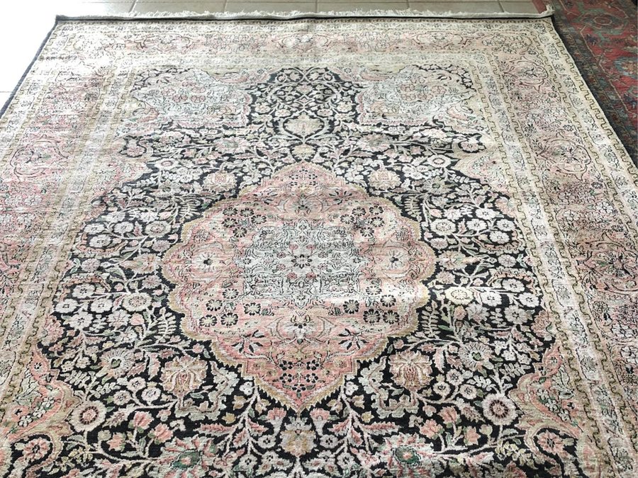 Kashmir silk rug — black field with ivory and pink floral medallion