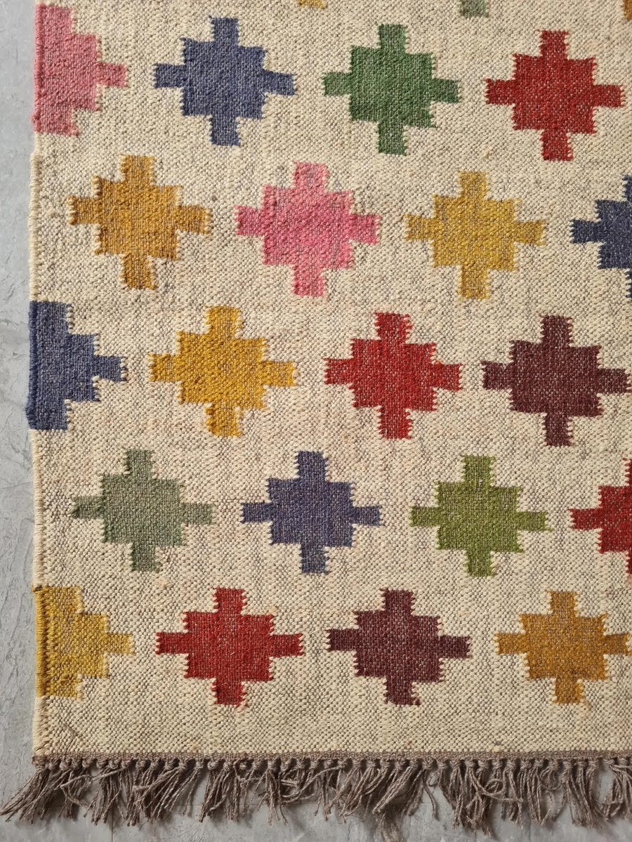 Indian dhurrie — ivory ground with multicoloured geometric cross motifs