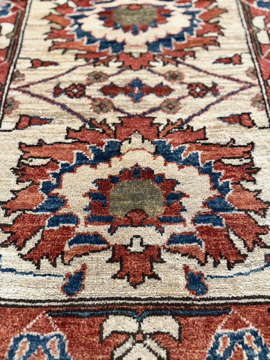 Chobi Pakistani rug — ivory field with terracotta and blue geometric floral