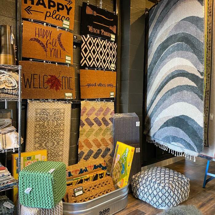 A wall of hanging rugs at Simonian